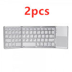 Two foldable Bluetooth keyboards with white key layouts and trackpad panels