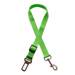 Adjustable pet car seat belt strap with bright green buckle and metal clip