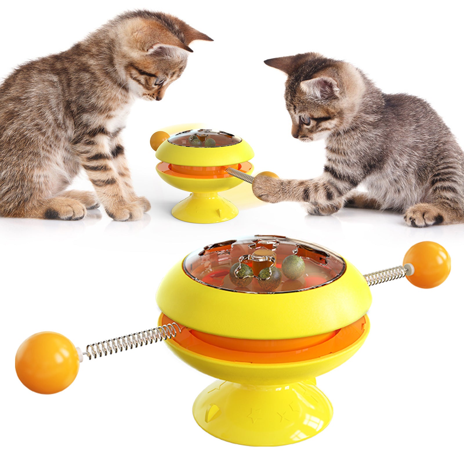 Rotatable cat training toy with yellow and orange base, amber dome, spring track and ball