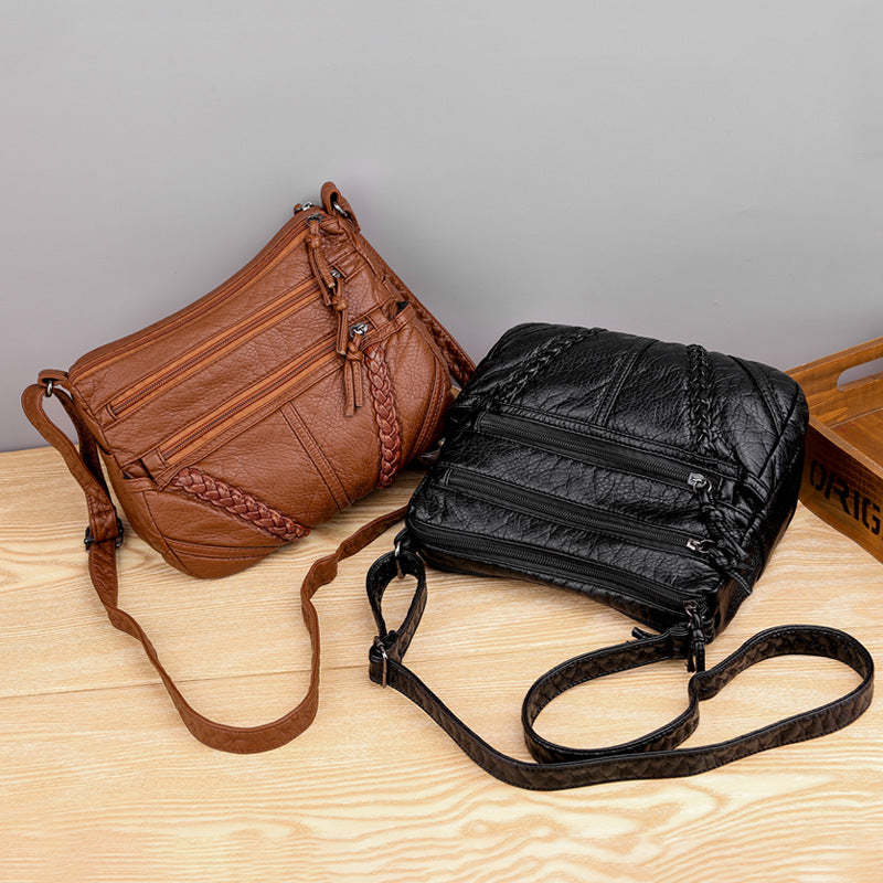 Brown and black soft PU leather messenger bags with braided front detail and zip pockets