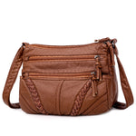 Brown soft PU leather crossbody messenger bag with braided front panel and adjustable strap
