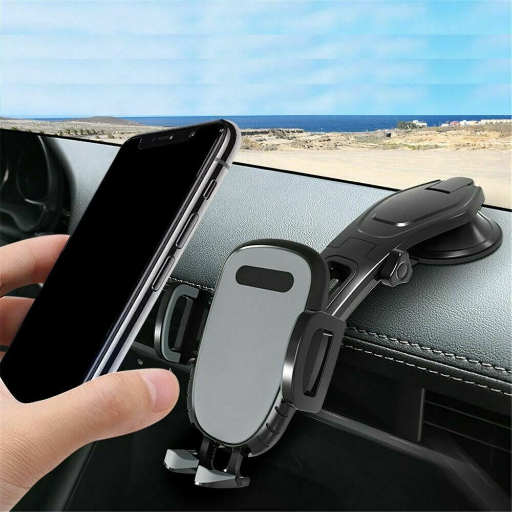 Car phone mount clipped to dashboard with rotatable cradle and side support bars