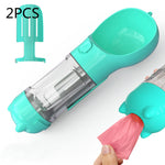 Teal portable pet water bottle feeder with transparent tube and pink waste bag holder
