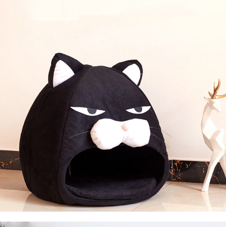 Black cat-face pet bed nest with hood opening and plush cushioned interior