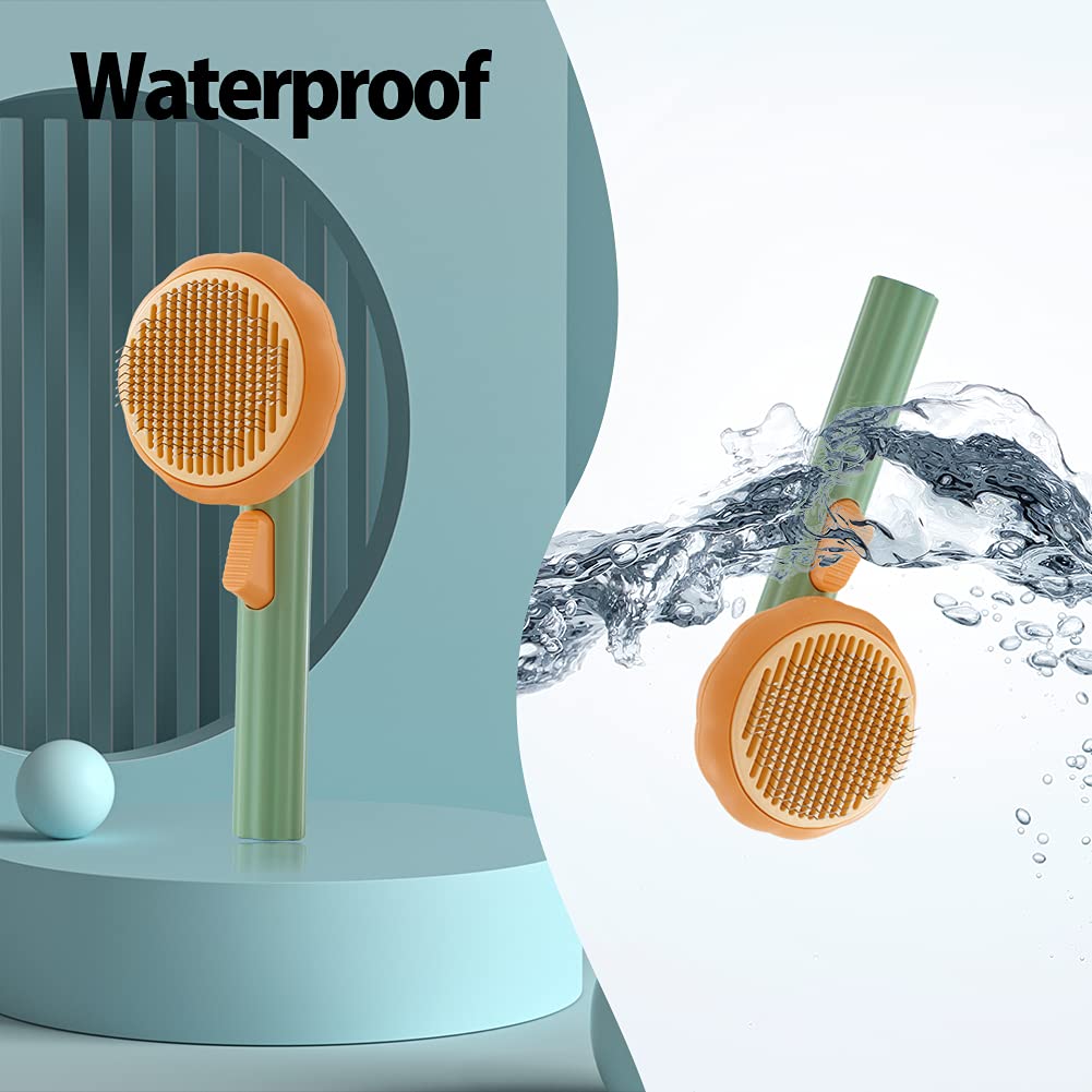 Pet grooming slicker brush with orange head and green handle with visible water droplets