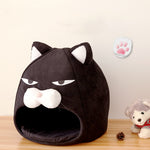 Black cat-face pet bed nest with hood opening and plush cushioned interior
