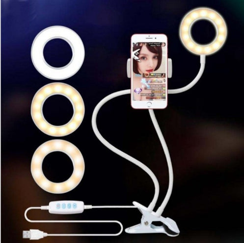 LED selfie ring light with multiple color rings, smartphone on clamp, dual cables