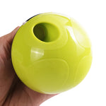 Green pet food dispenser ball toy with side opening and circular treat outlet