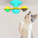 Cat rotating windmill toy with turquoise base, blue spiky wheel, and yellow rotating cups