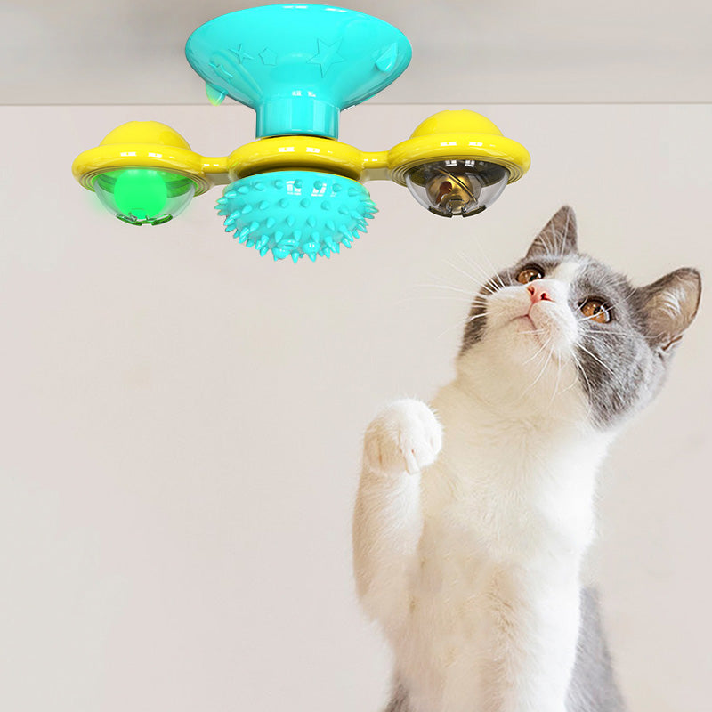 Cat rotating windmill toy with turquoise base, blue spiky wheel, and yellow rotating cups