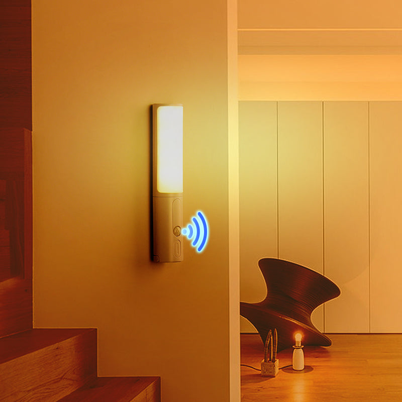 Wall-mounted LED night light with glowing panel and circular motion indicator, gray base