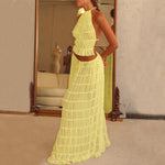 Yellow halter crop top and pleated long skirt set with tiered ruffles, side view