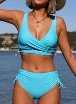 Sky blue strappy bikini swimsuit with crossover V-neck top and ruched side-tie bottoms