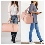 Blush pink waterproof duffle bag with top handles and long shoulder strap, worn by model