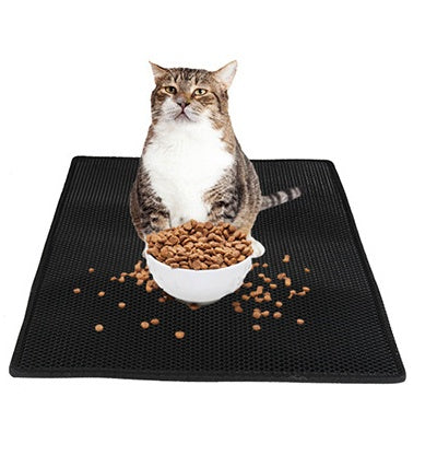 Waterproof cat litter pad, black honeycomb texture with tabby cat beside food bowl