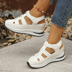 White wedge platform sandals with strap details and chunky rubber sole