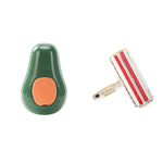 Avocado-green pet grooming brush with orange pins and a red roller cleaning comb