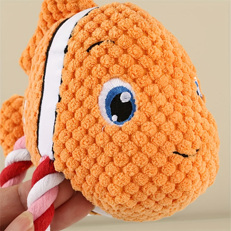 Orange turtle-shaped plush dog chew toy with white stripe and rope limbs