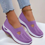 Women's mesh slip-on flats in lavender with cutout toe, side view and white sole.