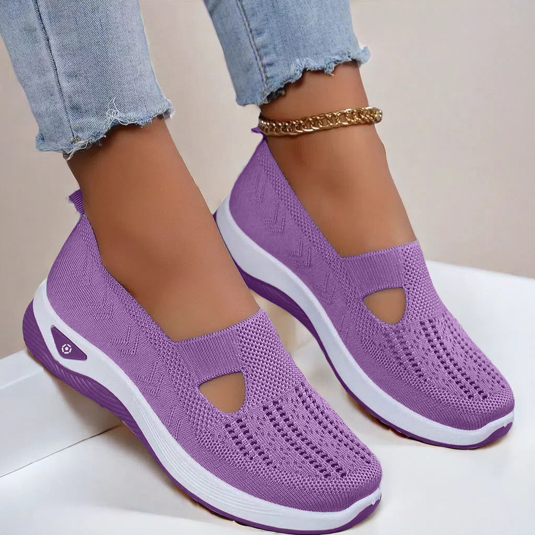 Women's mesh slip-on flats in lavender with cutout toe, side view and white sole.