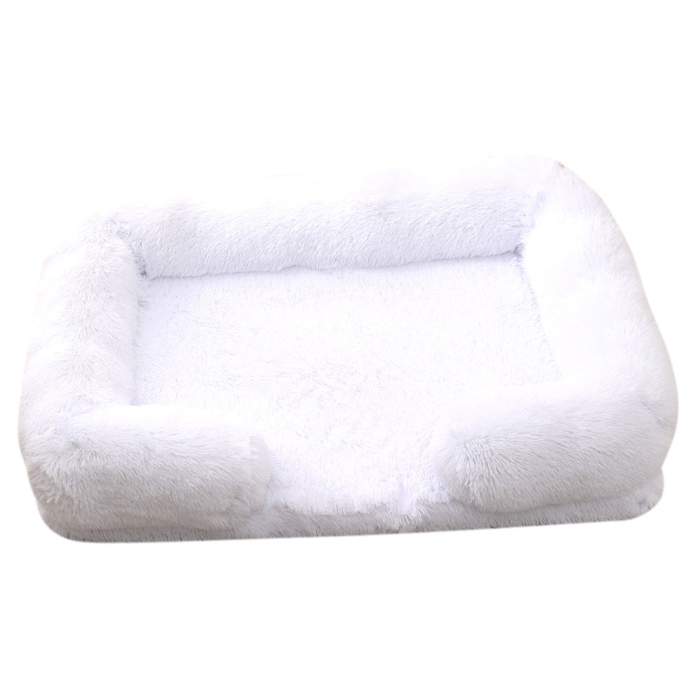 White plush dog bed with padded sides and rounded bolster base