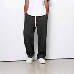 Waffle loose drawstring trousers in black with straight, relaxed fit