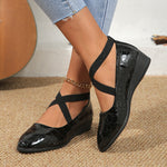 Women’s pointed toe cross-strap wedge flats in black patent with elastic band at ankle
