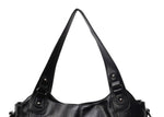 Women’s retro PU handbag top area in black, with double buckle handles and metal studs.