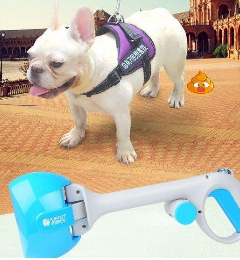 Dog waste scooper with blue and white handle, shown next to a standing white dog.