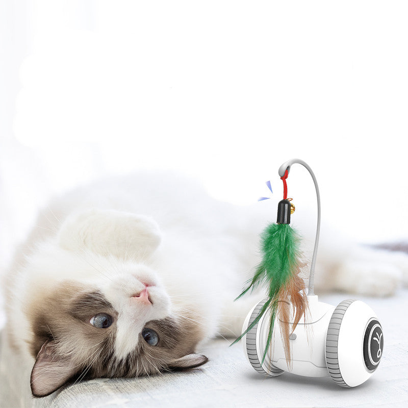 Interactive cat toy robot with green and tan feather wand