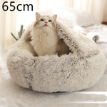 Round cream shag plush pet bed with open center and pet resting