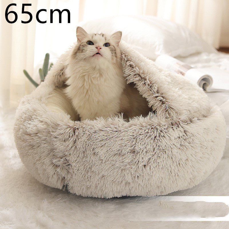 Round cream shag plush pet bed with open center and pet resting