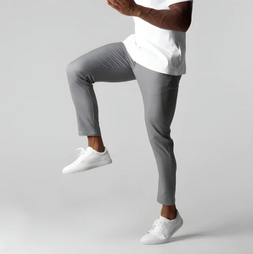 Gray slim fit business suit pants with button waistband and straight tapered legs