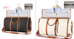 Two foldable waterproof duffle bags, dark gray and cream with tan shoulder straps