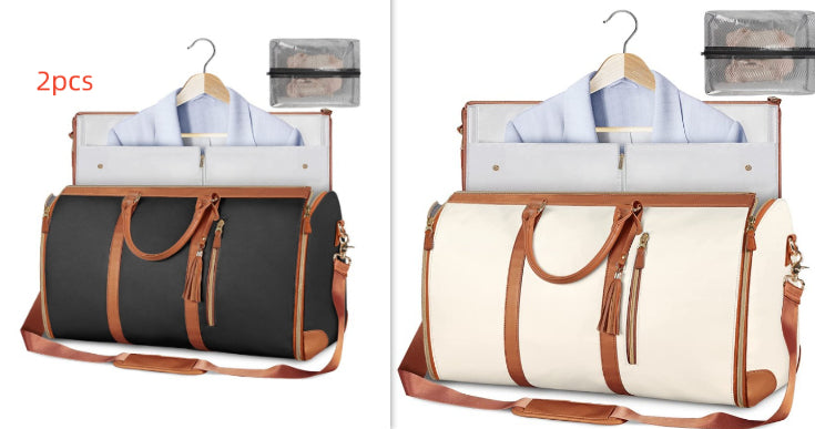 Two foldable waterproof duffle bags, dark gray and cream with tan shoulder straps