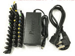 Universal power adapter with multiple DC tips, attached cord, and US two-prong plug