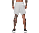White pocket compression shorts with elastic waistband and small drawstring detail