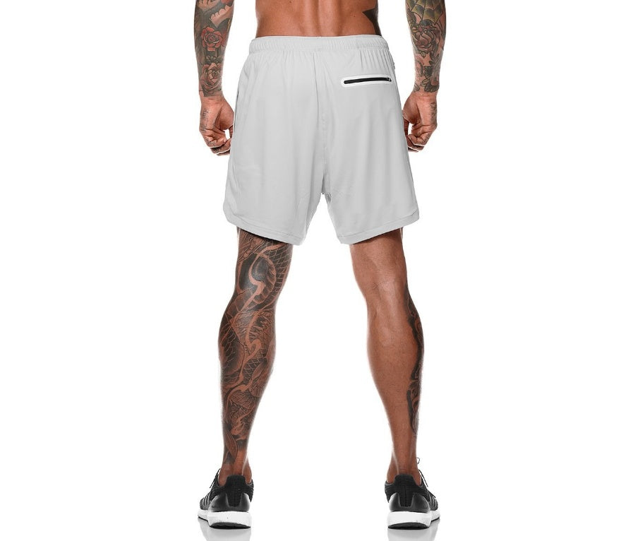 White pocket compression shorts with elastic waistband and small drawstring detail