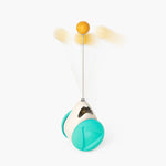 Teal windmill cat toy with white base and orange ball on top