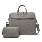 Dark gray PU laptop briefcase with zip pouch, top handle and shoulder strap.