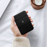 Black magnetic card holder wallet with flip cover, textured surface
