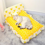 Small teddy pet bed with yellow geometric print and crown pattern bolster