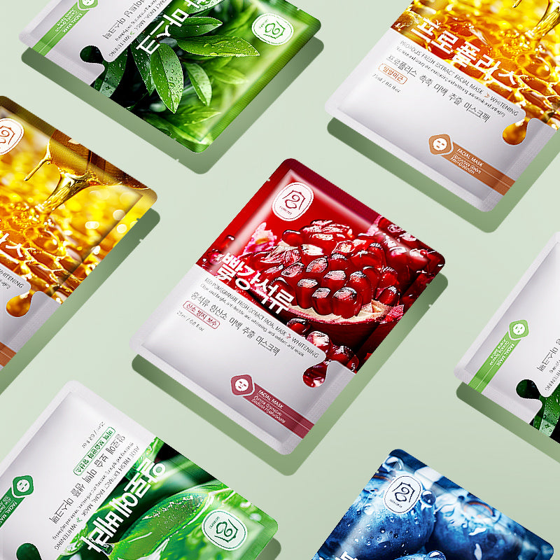 Assorted facial sheet mask pouches arranged in green, yellow, red, and blue