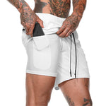 White compression sports shorts with drawstring and side pocket detail