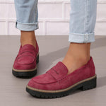 Women’s matte burgundy flat loafer shoes with round toe, buckle strap, and thick tread sole
