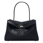 Black leather tote bag with top handle and center gold-tone clasp