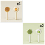 Pet grooming massage comb set with orange and green round bristle brushes on white handles