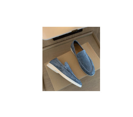 Light blue slip-on loafers with flat sole, stitched moc toe detail