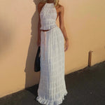 White halter crop top and tiered pleated maxi skirt set with ruffle tiers