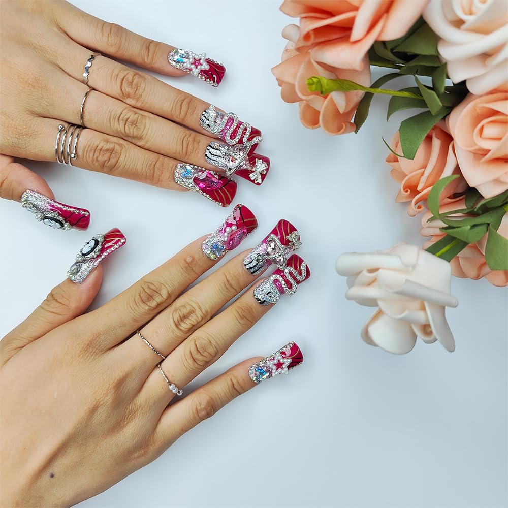 Medium square nails on hands with red and silver glitter, rhinestones, stars and butterflies